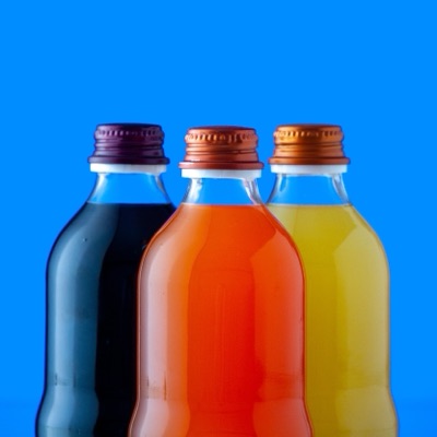 Three unlabelled bottles of functional drinks side by side, the shelf comparison the course teaches you to make.